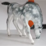 Sculpture Grazing foal Grey in apples. Lomonosov