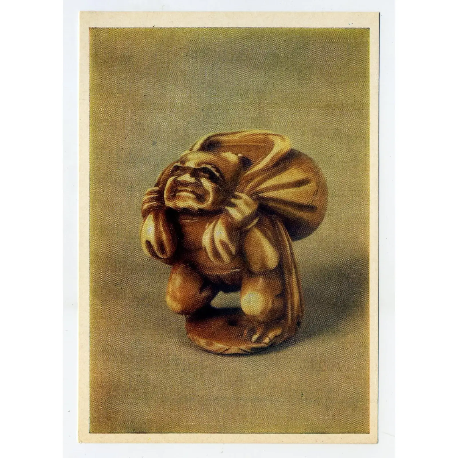 Vintage Postcard Netsuke MASTER ISCIN Futen, deity of wind Vintage wind deity netsuke postcard featuring Futen, 18th-century Japanese ivory carving